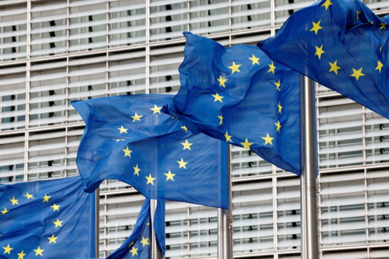 FILE PHOTO: European Union flags flutter outside the EU Commission headquarters in Brussels, Belgium